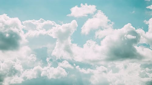 Cloudy Blue Sky With Fluffy Clouds
