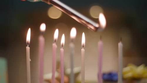 Lighting Multiple Candles on Birthday Cake Close Up