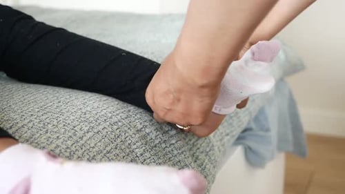 Putting Sock on Foot at Home