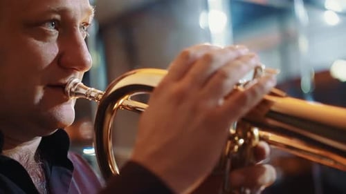 Musician Performs with Trumpet in Lively Atmosphere at a Local Venue