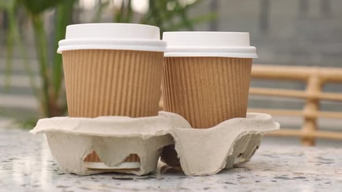 Coffee Cups on Table in Urban Setting