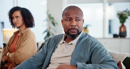 Upset Couple in a Living Room