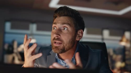 Man Reacts to Bad News at the Computer