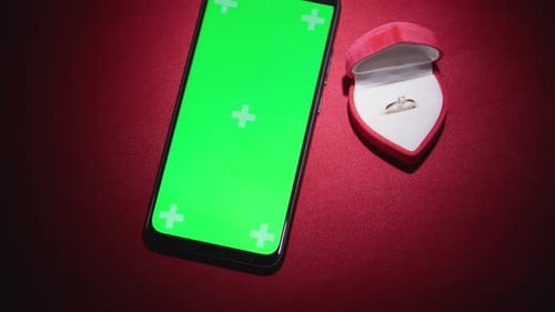 Smartphone Green Screen next to Engagement Ring