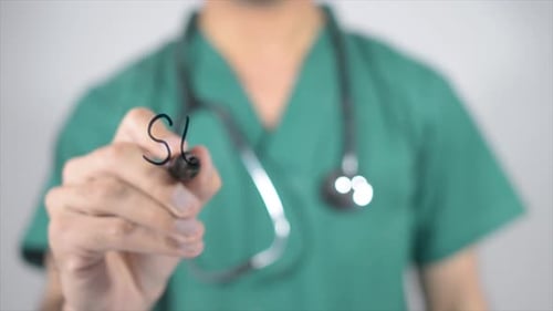Surgeon Writing on Clear Screen in Close Up