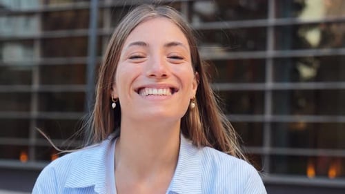 Close Up Individual Video of a Joyful and Adorable Teenage Blonde Woman with Friendly Expression