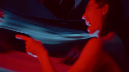 Mad Man Laughing Evilly and Expressing Anger in front of Distorting Mirror