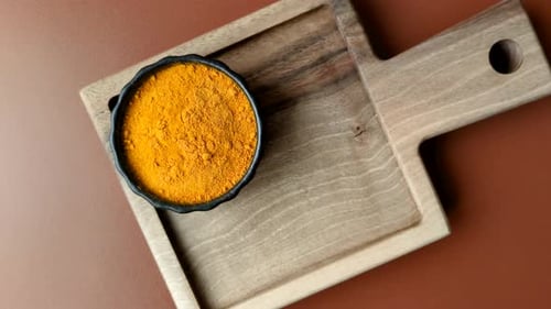Small Bowls Filled With Spices on Wooden Board