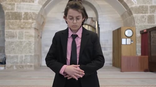 Boy Praying in Mosque