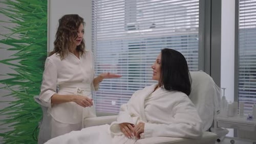 Woman Receiving Consultation in Bright Beauty Clinic