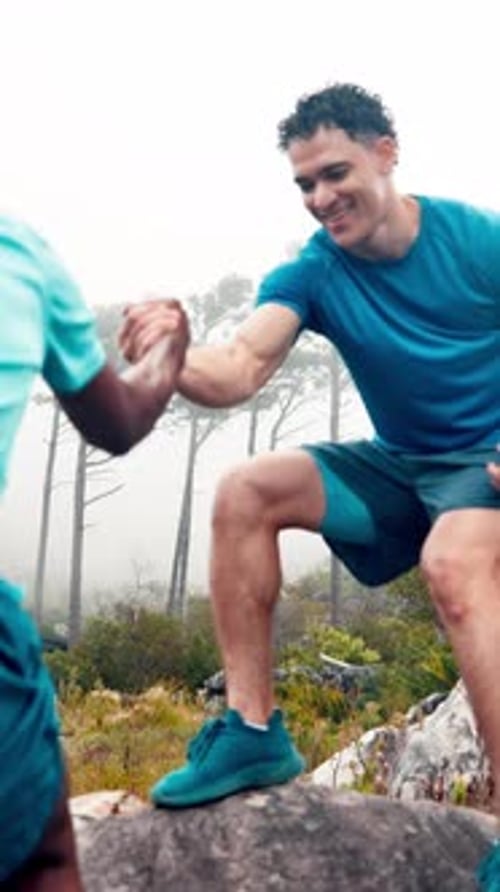 Mountain, help and men on rock for exercise, hiking and trekking for health, wellness and adventure