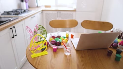 Colorful Decorated Easter Eggs and Cakes on Table