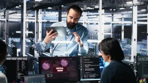 Data Center Manager Coordinates Programmers Fixing Critical Error While Using AI