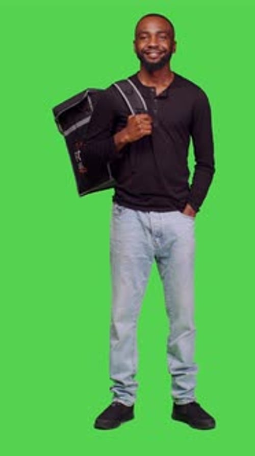 Vertical Video Front View of African American Person Working As Deliveryman on Camera