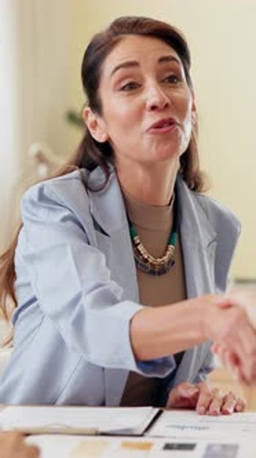 Office, businesswoman and happy with shaking hands for promotion, winning