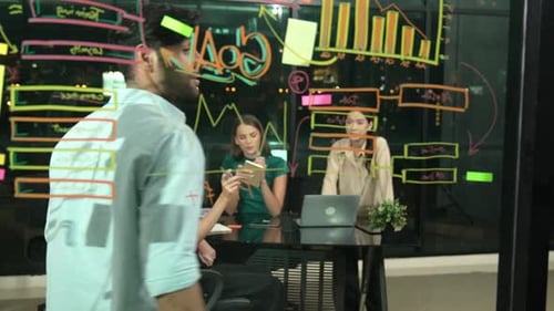 Business Meeting in Modern Office at Night