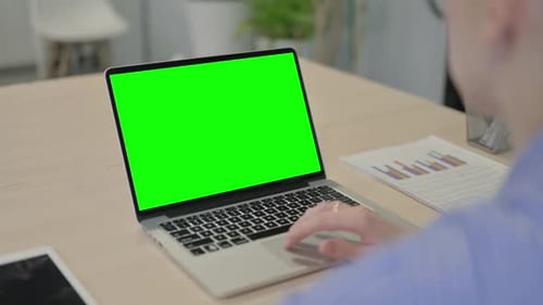 Businesswoman Using Laptop with Green Screen