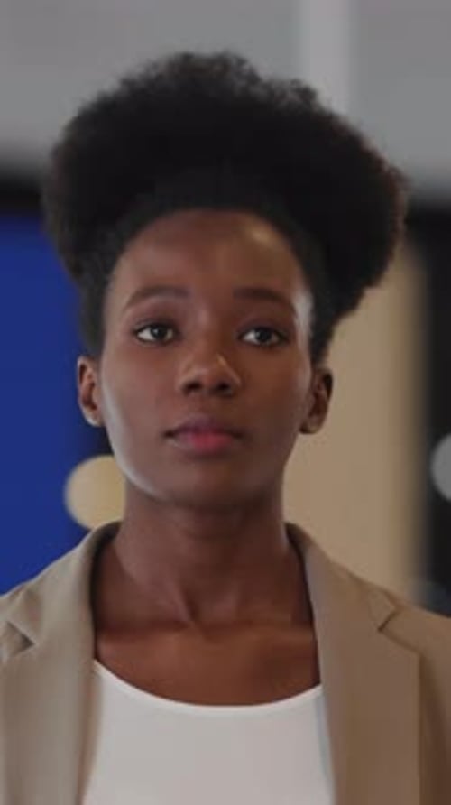 Beautiful Young Professional Woman Walking to Her Office in Large Contemporary Business District