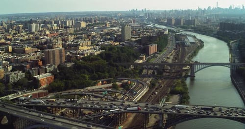 Manhattan bridges from above a New York City skyline on an overcast day