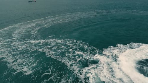 Jet Ski Making Sharp Turns in Blue Ocean Water