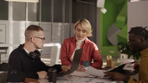 Creative Diverse Team Brainstorming in Sunlit Office