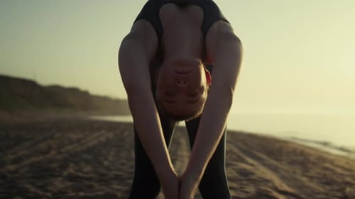 Sexy Girl Practicing Yoga On Sandy Beach Close Up. Yogi Woman Training Flexibility Bending Body O...