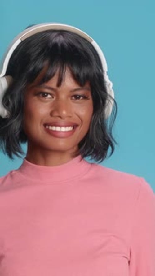 Happy Woman Smiling in Headphones Listening Music Portrait