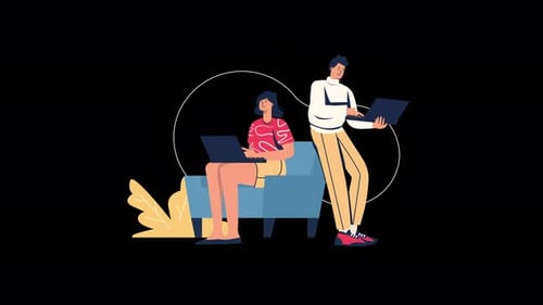 Two individuals working on laptops in a modern setting