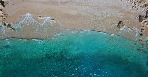 Aerial view of sea and clear turquoise waves