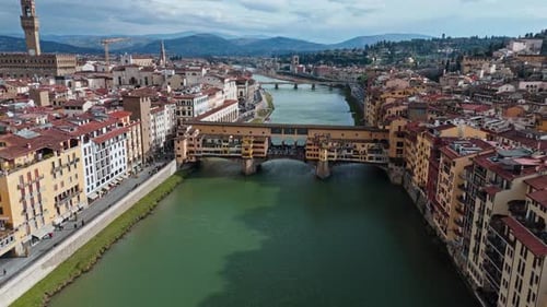 Aerial view of Ponte Vecchio bridge over Arno River in Florence, Italy, historic landmark