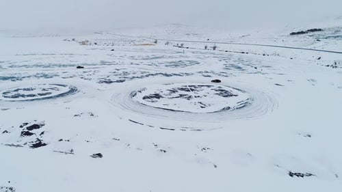 Cars Drifting on Snowy Ice Track in Winter Aerial Drone View
