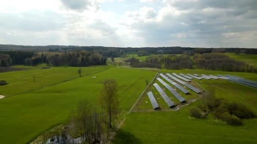 Aerial View of Solar Panels in Rural Field