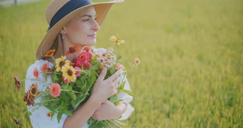 Thoughtful Dreamy Woman Holding Bouquet of Flowers