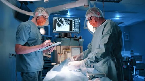 Surgeons Performing Surgery in Operating Room