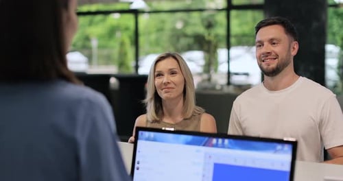 Administrator Giving Tourist Man Key Card at Hotel Desk Concierge Service Woman Smile in Lobby for