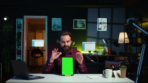 Tech Specialist Presenting Chroma Key Tablet