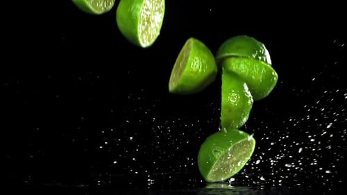 Sliced Lime Falls on a Wet Table Filmed on a Highspeed Camera at 1000 Fps