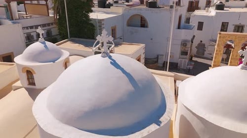Aerial View of Iconic White Domed Roofs in Sunlit Mediterranean Village