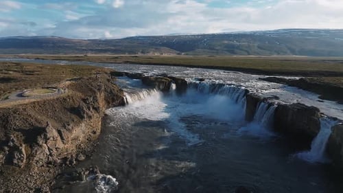 Aerial View of the Powerful Godafoss Waterfall on a Sunny Day in Northern Iceland