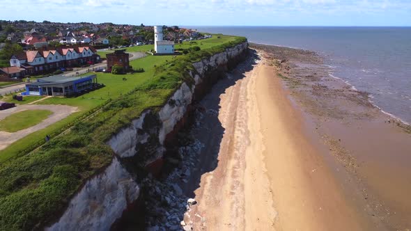 Aerial view of Hunstanton beach, cliff face and lighthouse. Hunstanton ...