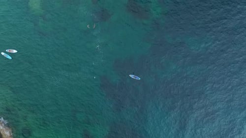 Aerial View Paddleboarding Through a Pristine Mediterranean Lagoon