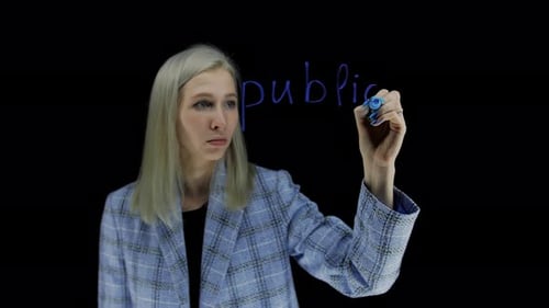 Woman Writing on Transparent Surface with Blue Marker