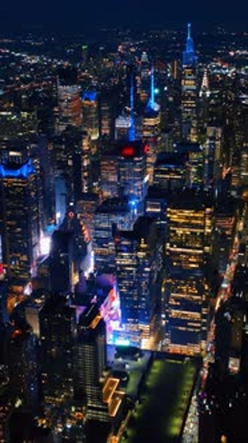 Cityscape sparkling with billions of lights. Majestic New York panorama at night.