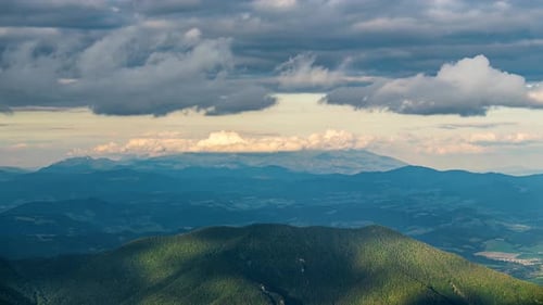 Clouds Sky Moving Fast Over Green Forest Mountains Landscape Time Lapse