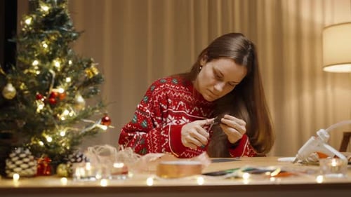 Woman Crafting Christmas Decoration at Home
