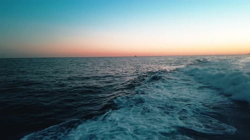 Ocean Waves at Colorful Sunrise on the Shore