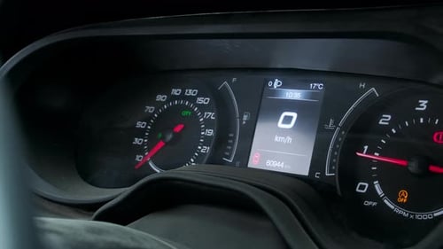 Car Dashboard Displaying Speed and Mileage