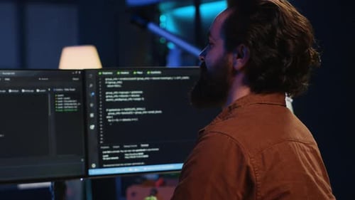 Smiling Freelancing Developer in Home Office Doing Coding on Computer