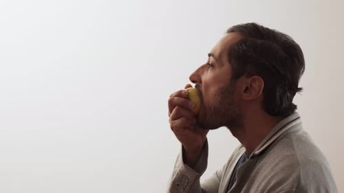 Man Eating Apple Close Up Profile
