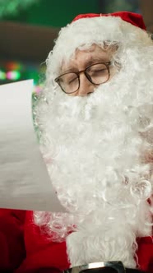 Vertical Video Tired Man Dressed As Santa Claus Falling Asleep While Reading Letters From Kids